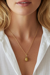 “New birth” egg drop necklace