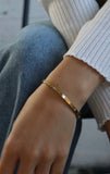 Diamond station gold bangle bracelet