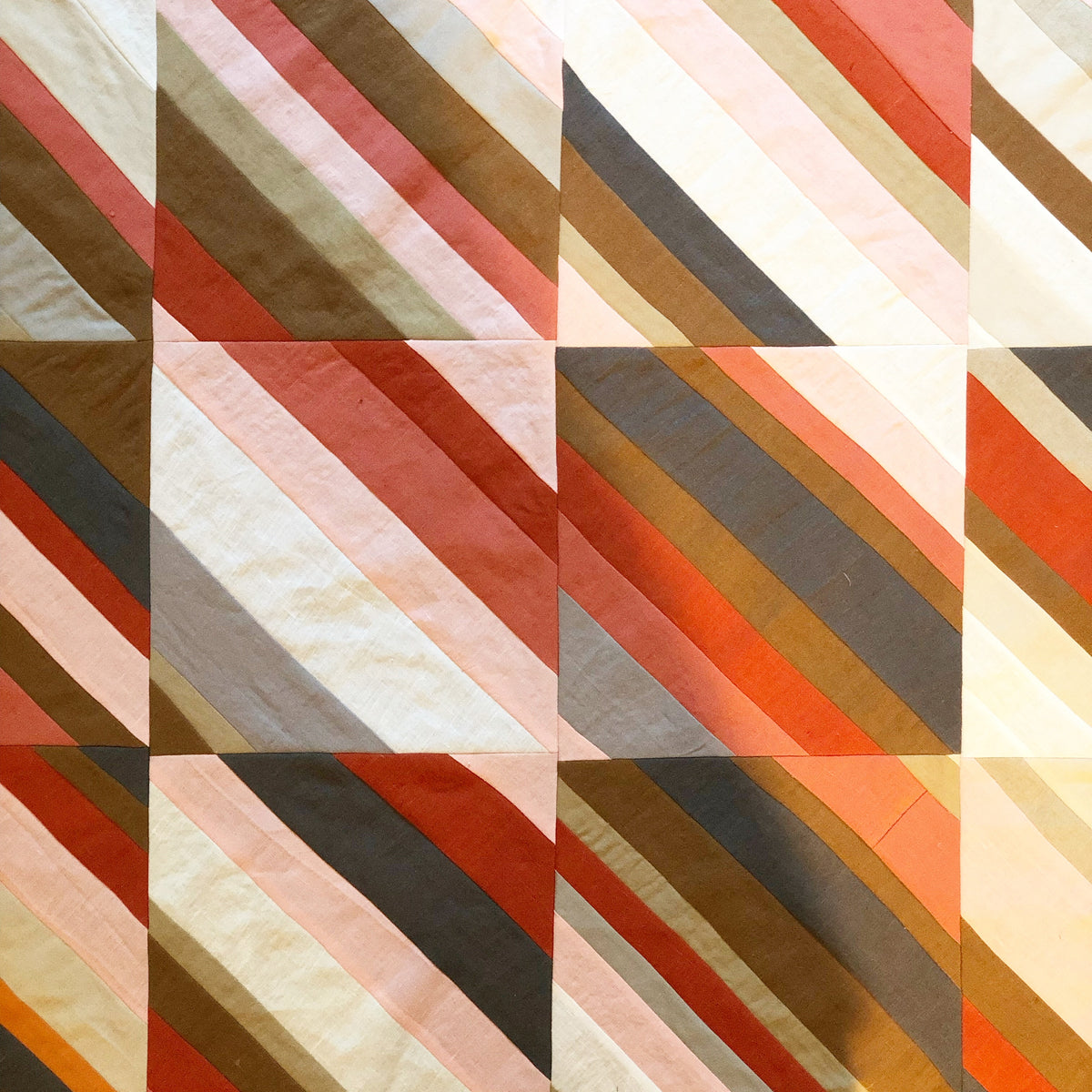 Quilt shadows to light, oranges - abigailheche